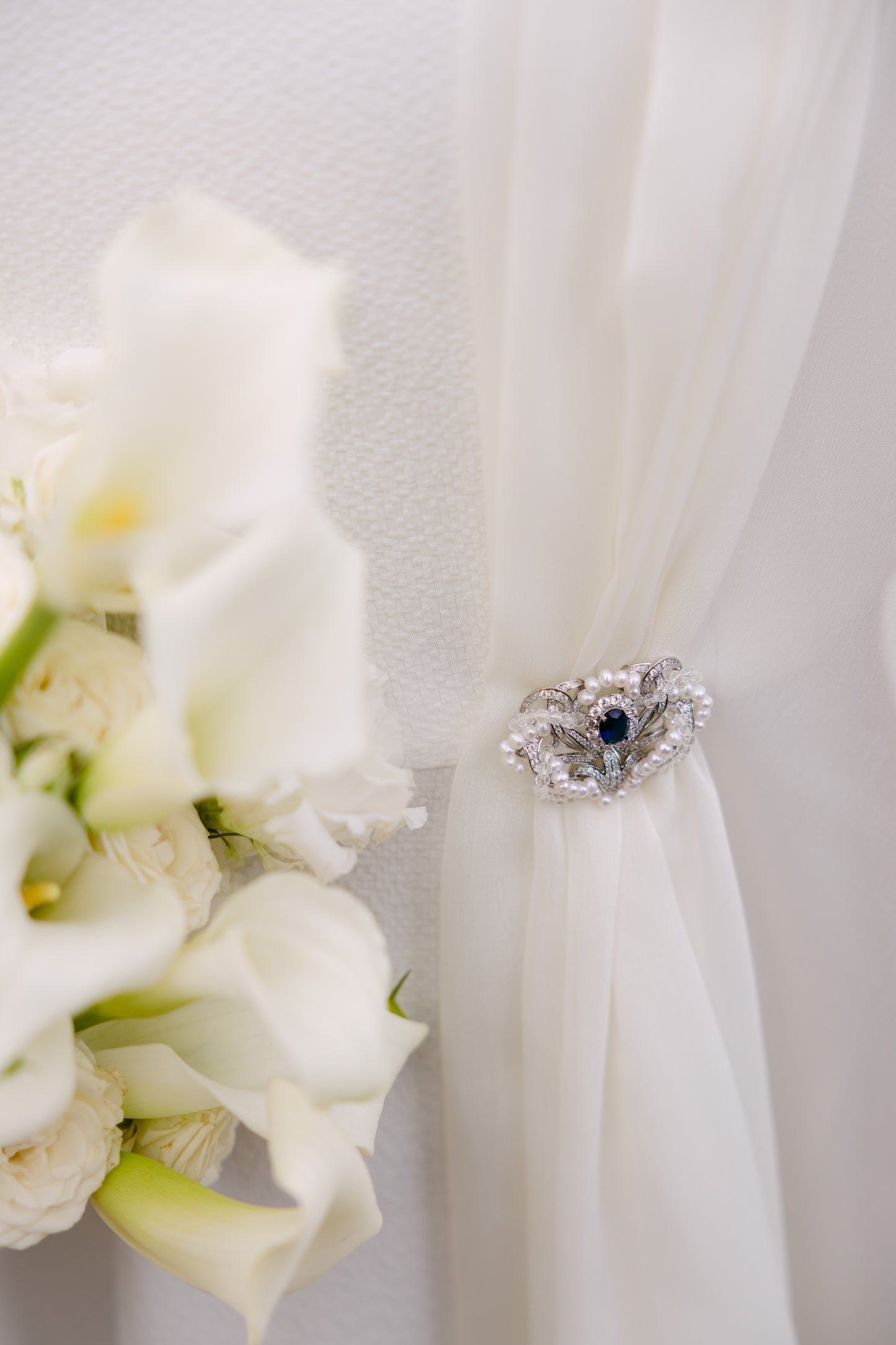 brooch holding a wedding dress