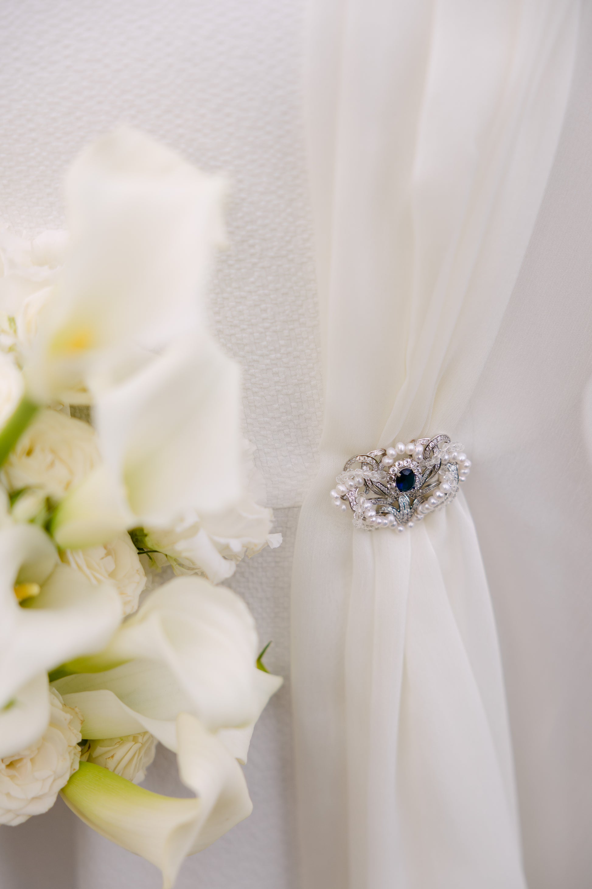 brooch holding a wedding dress