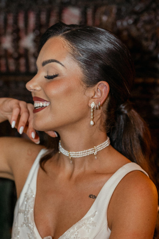 woman wearing choker and earrings