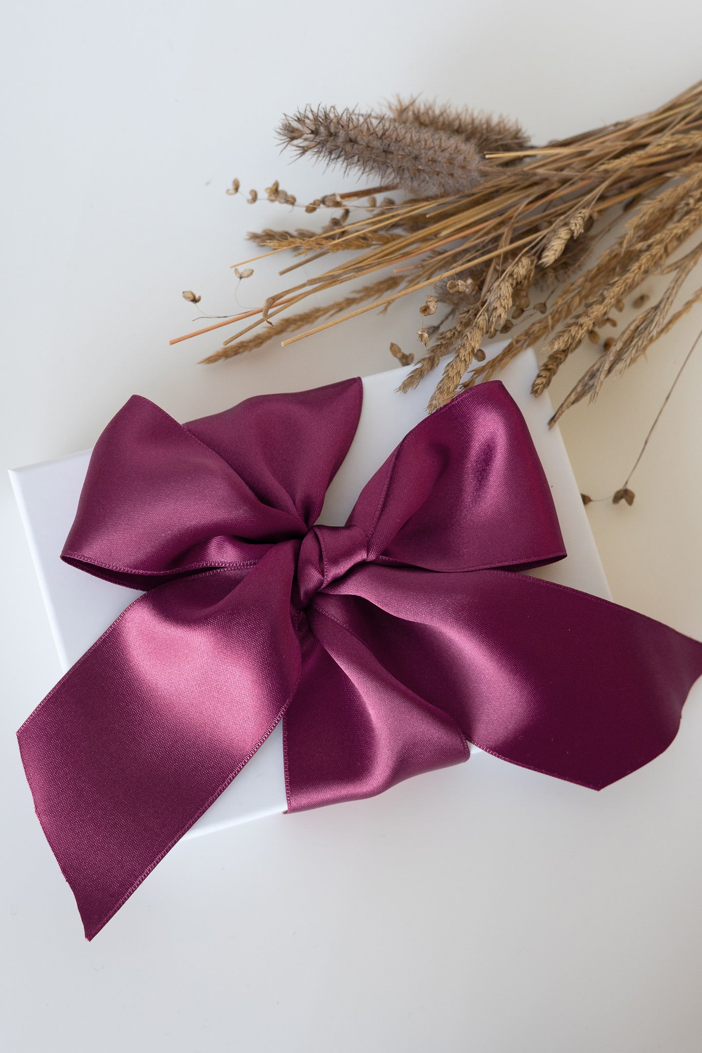 Giftbox with dusty pink ribbon 