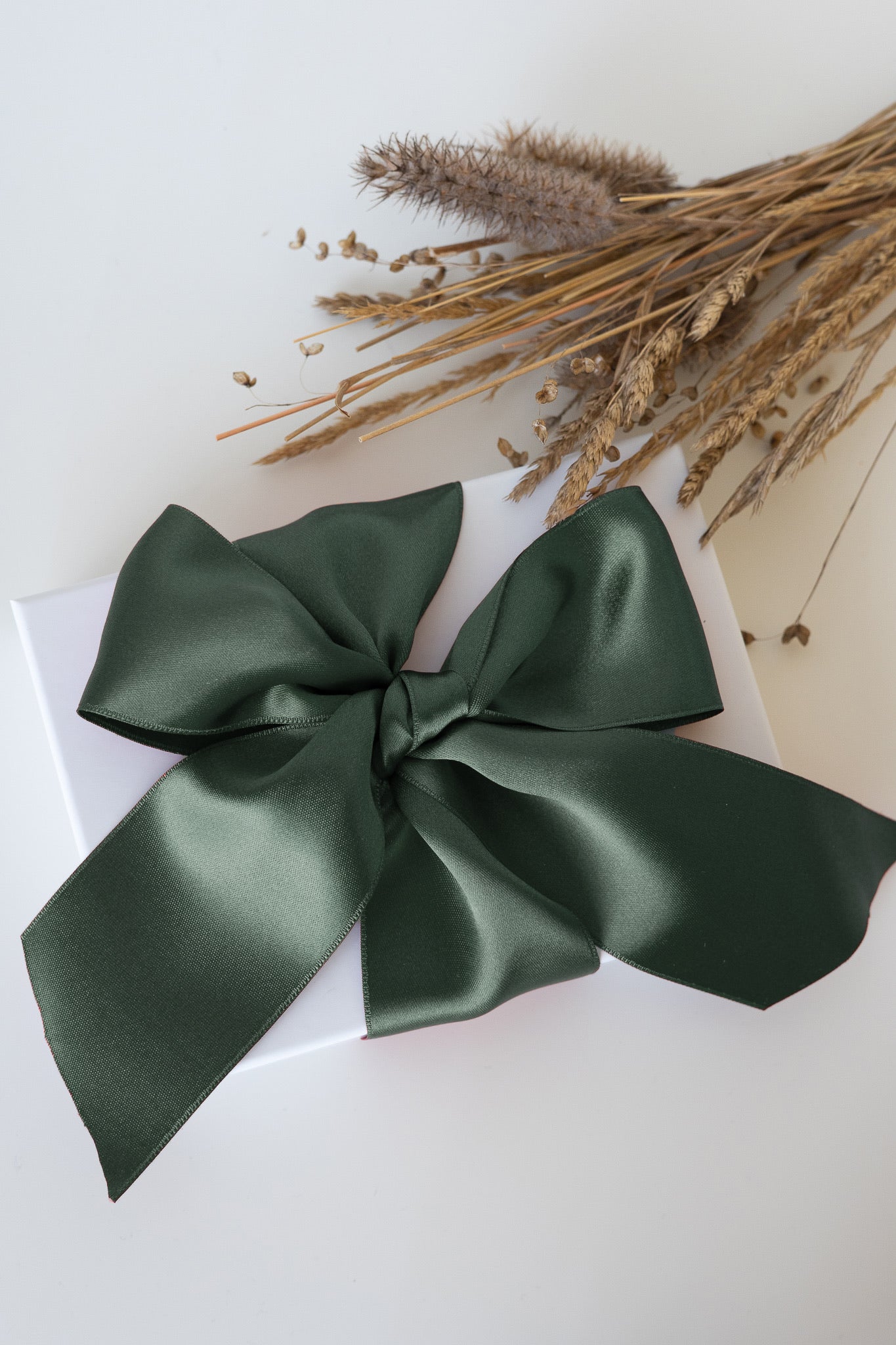 Giftbox with dark green ribbon 